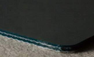 Двухслойная транспортерная лента с поверхность ленты из антистатичного ПВХ с гладкой глянцевой поверхностью тёмнозелёного цвета толщиной 3.8 мм,,Ра­бо­чая тем­пе­ра­ту­ра °С -15/+80